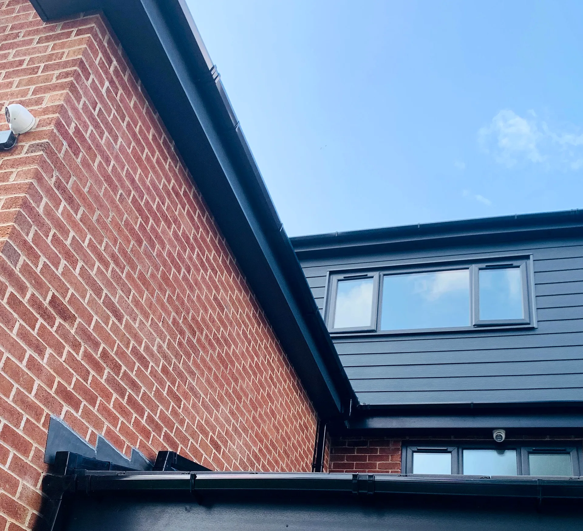 Brickwork, roof junctions and upper-level glazing