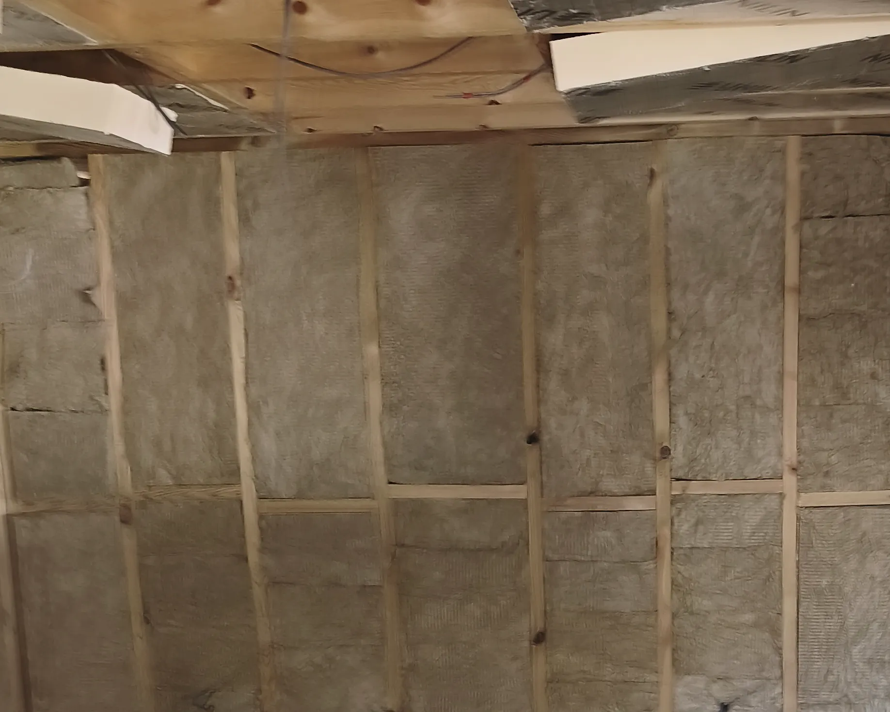 Wall insulation before enclosure