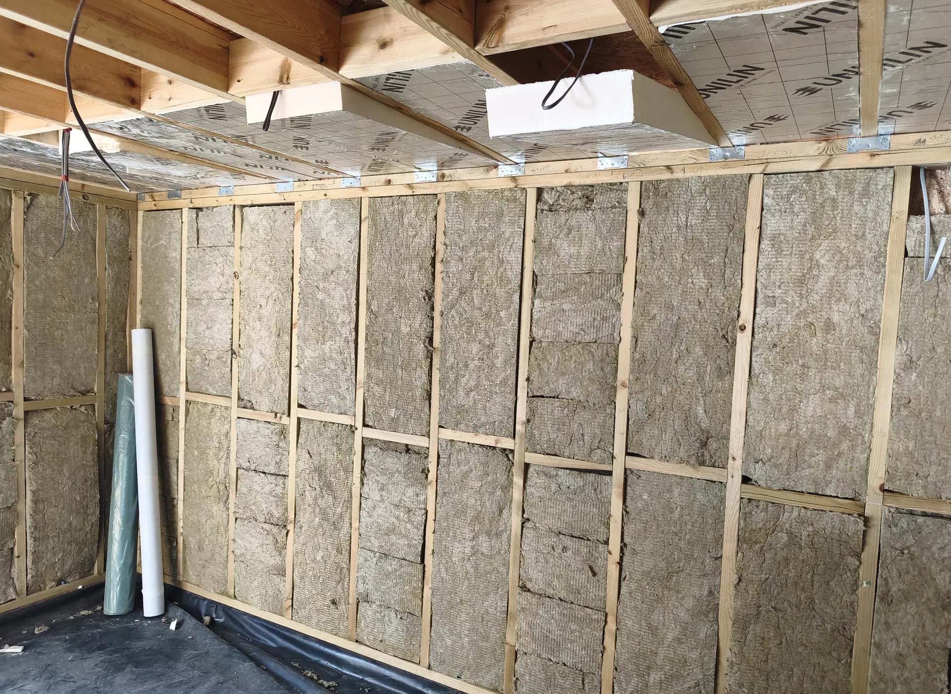 Wall and roof insulation before garden room lining